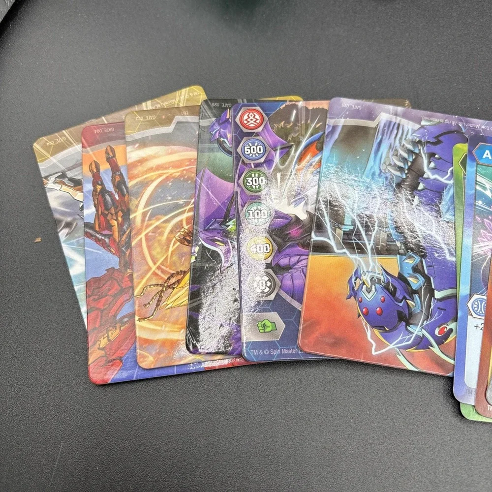 Lot Of 9 Bakugan Figures And 23 Bakugan Cards/Metal Card
